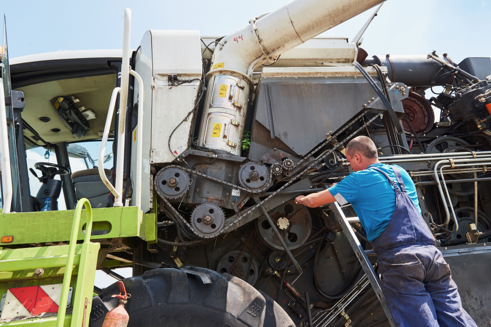 A tractor being fixed with parts from a John Deere delivery.